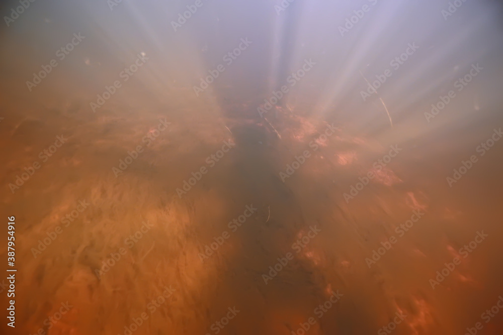 Naklejka premium rays of light under water, abstract marine background nature landscape rays blurred