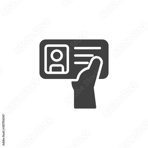 Hand holding ID card vector icon. filled flat sign for mobile concept and web design. Hand with identification card glyph icon. Symbol, logo illustration. Vector graphics