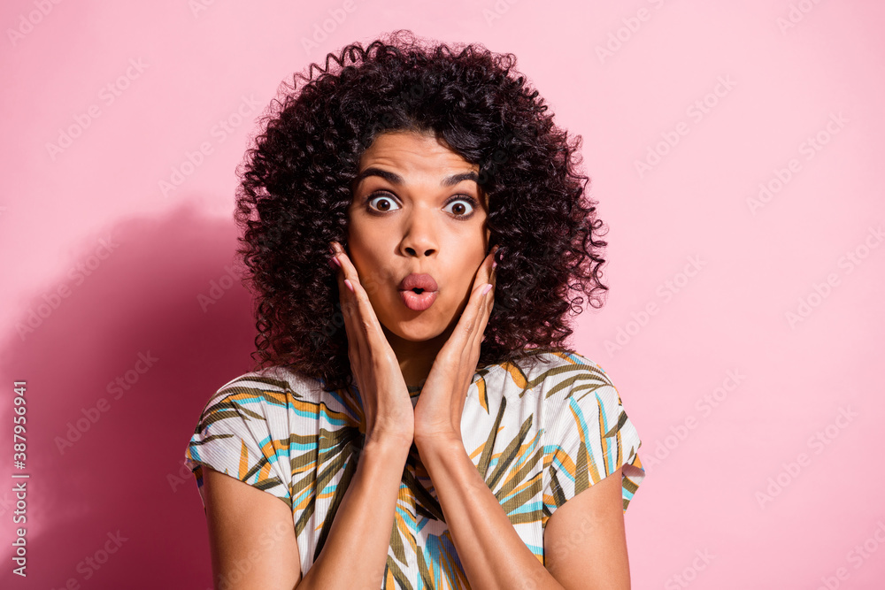 Photo portrait of shocked woman touching face with two hands isolated on pastel pink colored background Photo portrait of shocked woman touching face with two hands isolated on pastel pink colored background