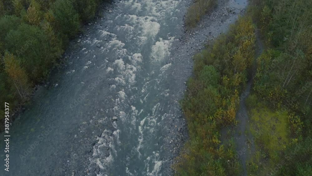 Top down view of the river rapids with stones on shores Top down view of the river rapids with stones on shores