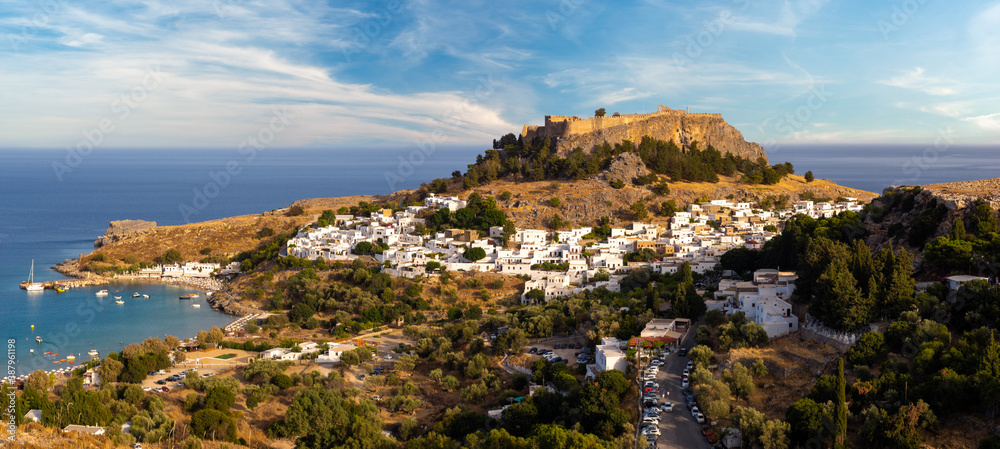 panoramic view of Lindos bay, village, fortress and Acropolis, Rhodes, Greece