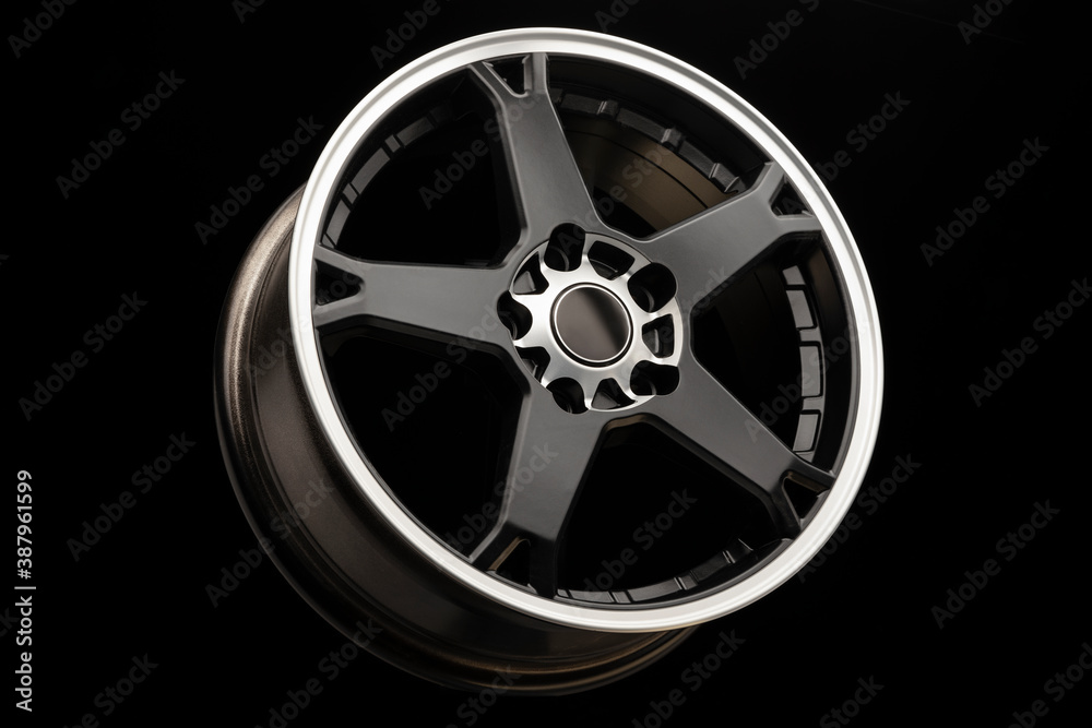 Obraz premium sporty light black alloy wheel with a white matte rim, close-up