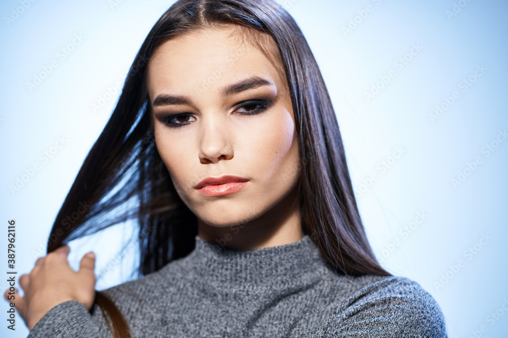 Beautiful woman cosmetics long hair cropped studio model Beautiful woman cosmetics long hair cropped studio model