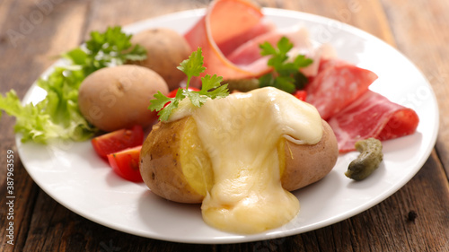 plate with potato, salami and raclette cheese