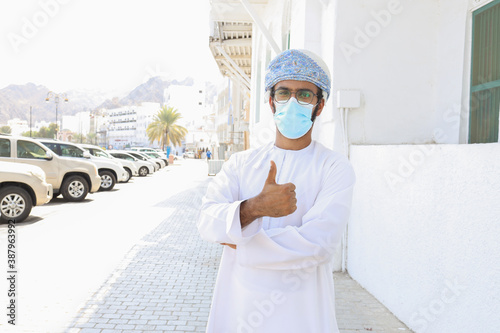 Oman man with face mask photo