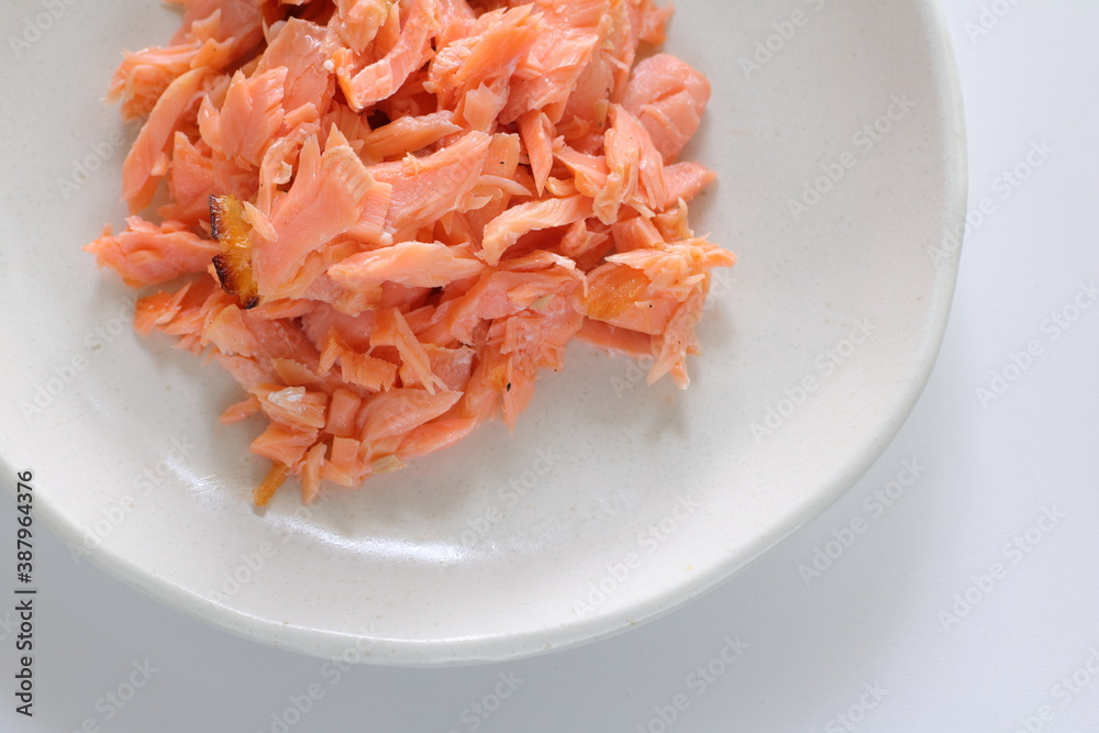 Japanese food, grilled salmon flake on dish with copy space Japanese food, grilled salmon flake on dish with copy space