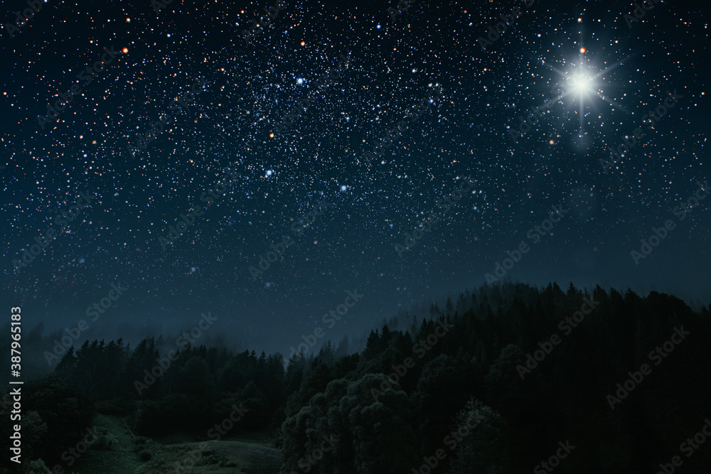 The star shines over the manger of christmas of Jesus Christ.