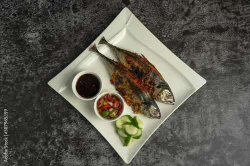 Принти на полотні Grilled Torpedo Scad fish (Ikan Cencaru Bakar in Malay) with hot soy sauce, hot