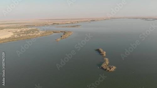 Aerial views of tourist gathering at Asfar Lake (Yellow Lake) in Al Hasa, eastern Saudi Arabia photo