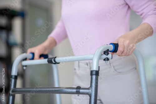 Close up of elderly woman with a rolling-walker