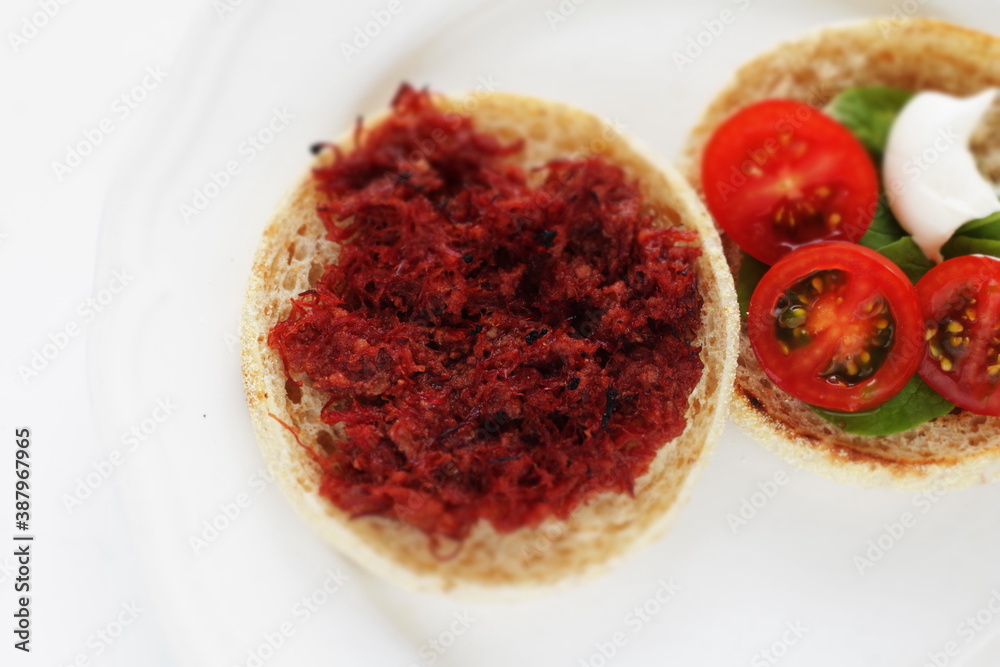 corned beef and cherry tomato in English muffin sandwich corned beef and cherry tomato in English muffin sandwich