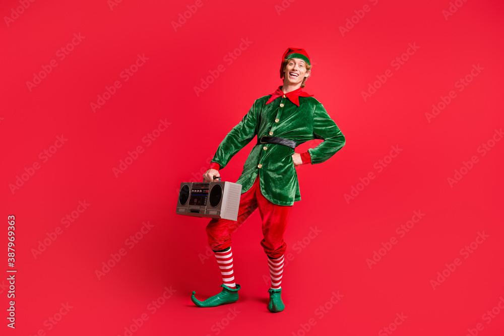 Full length photo of funky elf guy hold boom box wear x-mas christmas festive costume isolated on bright shine color background