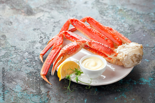 Crab legs with mayonnaise sauce, selective focus