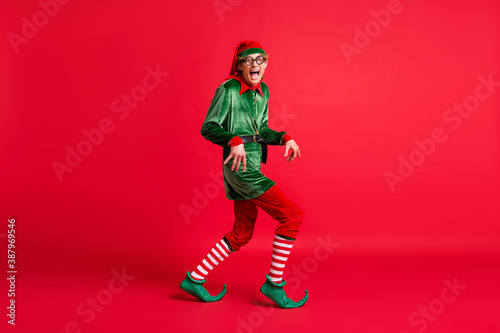 Full body profile side photo of crazy naughty elf sneak x-mas copyspace wear christmas headwear isolated on shine color background