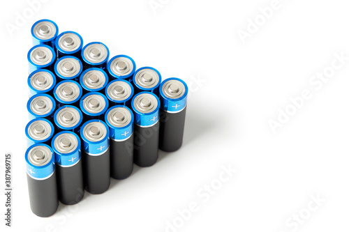 A closeup of many black batteries with a blue border.