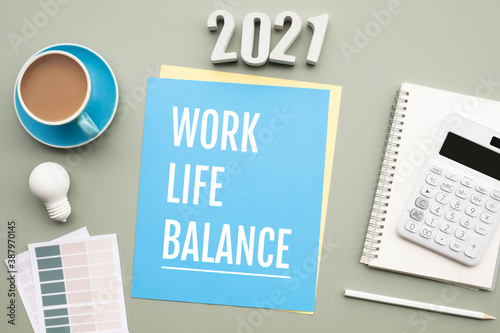 2021 work life balance concepts with text on desk.
