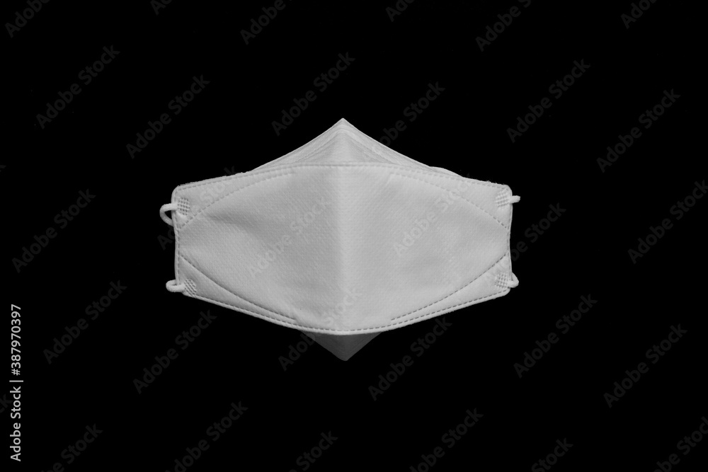 face protective dust masks isolated on black background