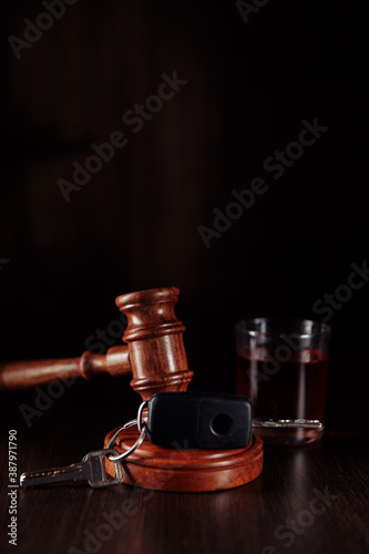 Fototapeta Car key, judge gavel and bottle of alcohol with glass