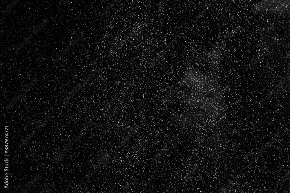 abstract real dust floating over black background for overlay abstract real dust floating over black background for overlay