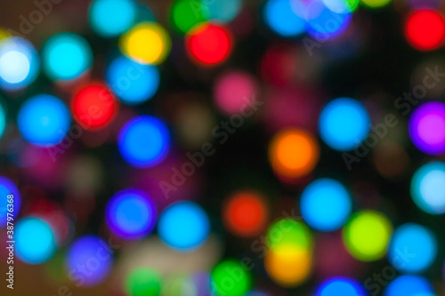 Multicolored Abstract bokeh lights, on a dark background (defocused, blurred)