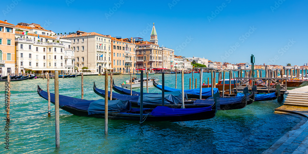 Picturesque view of Venice Grand Canal with gondolas and old buildings on banks of canal