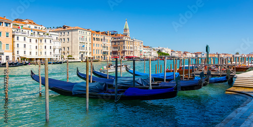 Picturesque view of Venice Grand Canal with gondolas and old buildings on banks of canal