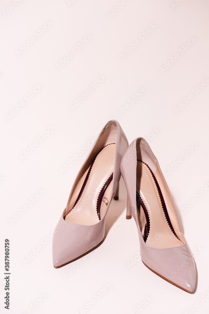 leather heeled shoes on beige background leather heeled shoes on beige background