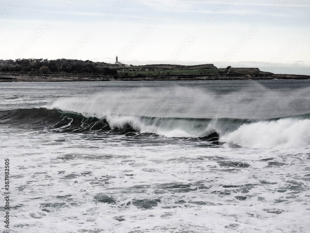 Spray surfing tube waves in the north coast of Spain, Santander
