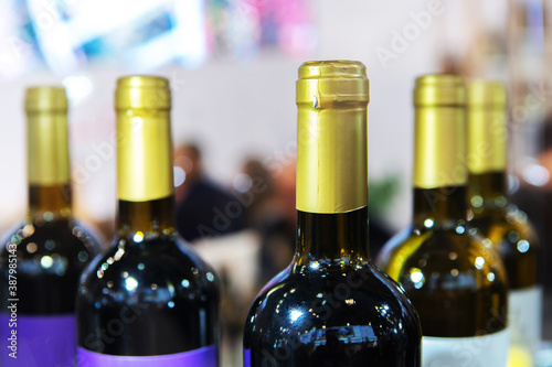 A fragment of red wine bottles. Trade in alcoholic beverages in the store.