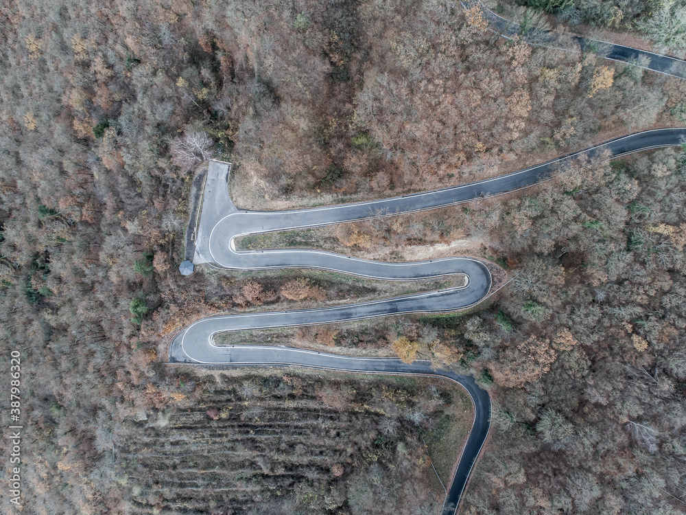 Seasons Concept winter or fall Aerial view Winding road serpentine mountain pass village Brodenbach Germany