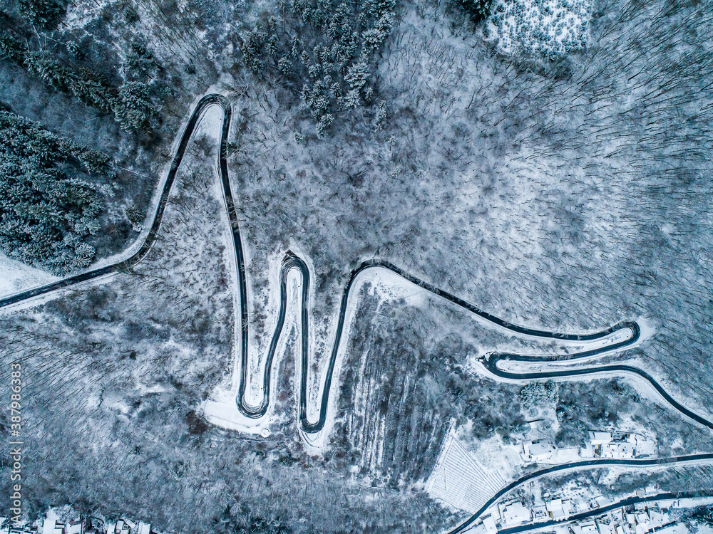 Seasons Concept winter snowy Aerial view Winding road serpentine mountain pass village Brodenbach Germany