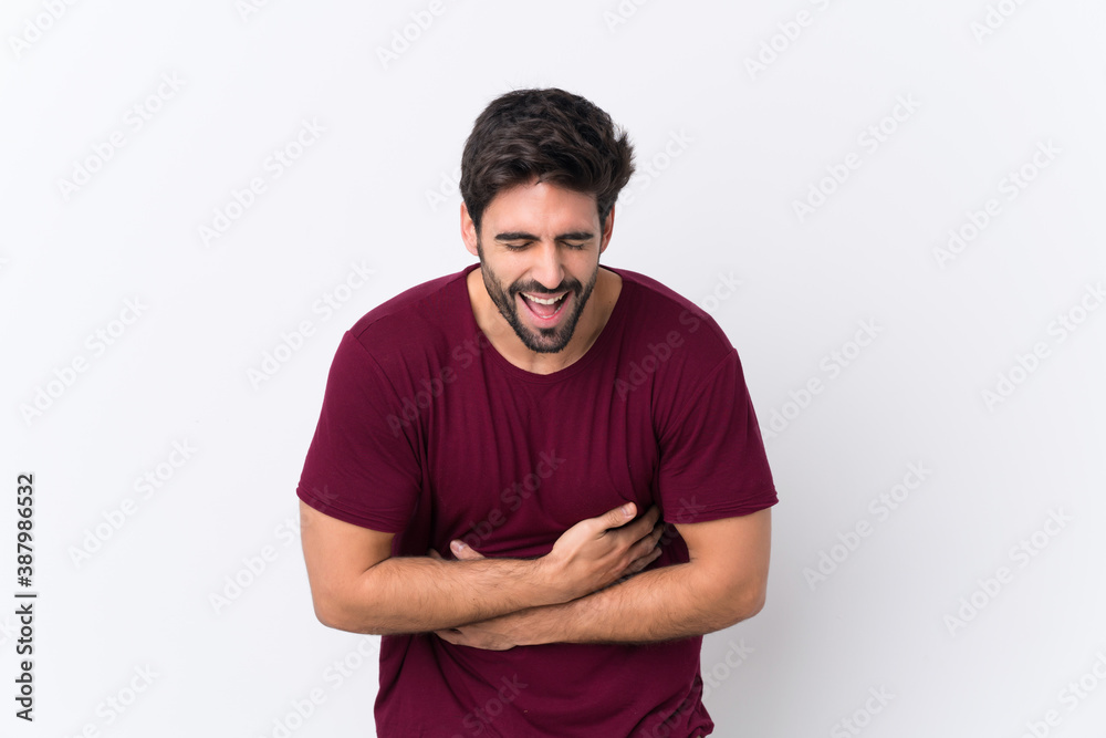 Fototapeta premium Young handsome man with beard over isolated white background smiling a lot