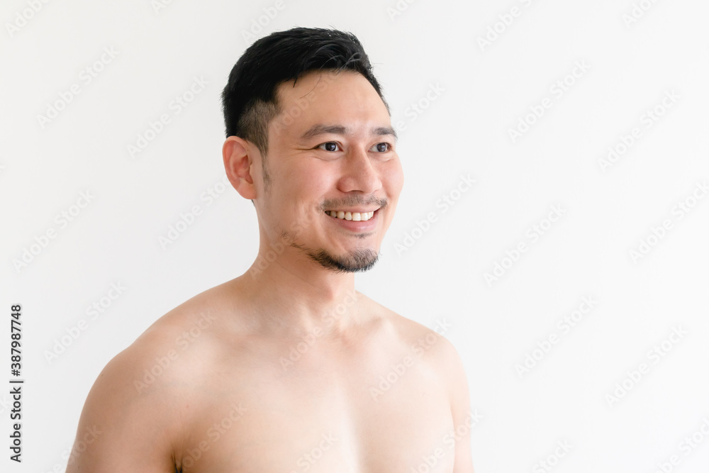 Topless portrait of a happy Asian man on isolated white background. Topless portrait of a happy Asian man on isolated white background.
