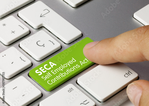 SECA Self Employed Contributions Act - Inscription on Green Keyboard Key.