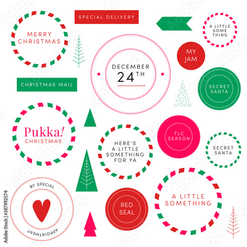 A pukka set of Christmas stickers Secret Santa decorative round postage stamps ribbons packaging embellishments. Heart shapes Christmas trees copy space. Timeless Holiday season colors red green blue photo