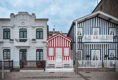 Tradittional fishermen's colorful houses in Costa Nova, Aveiro, Portugal. Tourism atraction. Red stripes