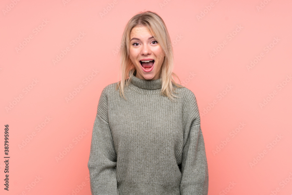 Young blonde Russian woman over isolated pink background with surprise facial expression