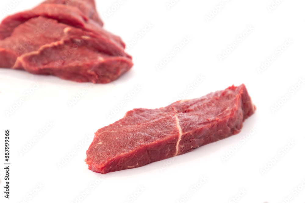 Fresh raw beef steak isolated on white background. Close up raw meat beef.