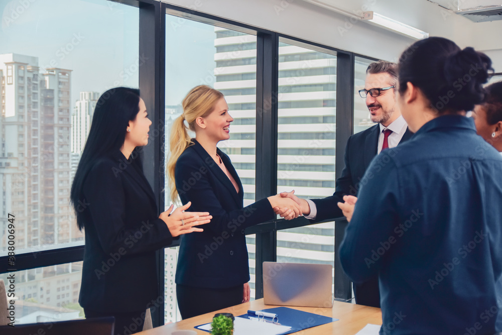 Businesspeople meeting in office teamwork discussing marketing project Businesspeople meeting in office teamwork discussing marketing project