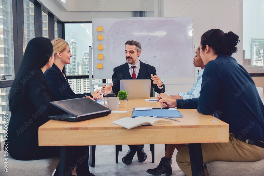 Businesspeople meeting in office teamwork discussing marketing project Businesspeople meeting in office teamwork discussing marketing project