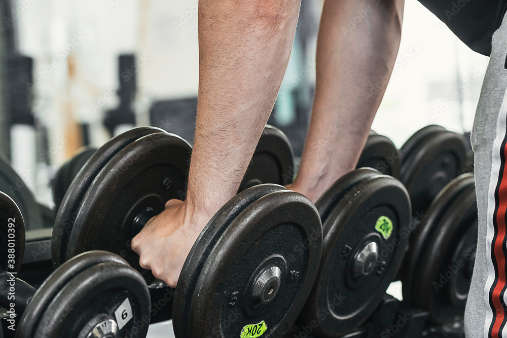 lifting weights in the gym. Material care. lifting weights in the gym. Material care.