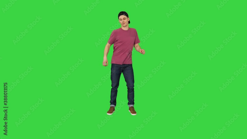 Caucasian man rapper does some stylish light dancing on a Green Screen, Chroma Key. Caucasian man rapper does some stylish light dancing on a Green Screen, Chroma Key.