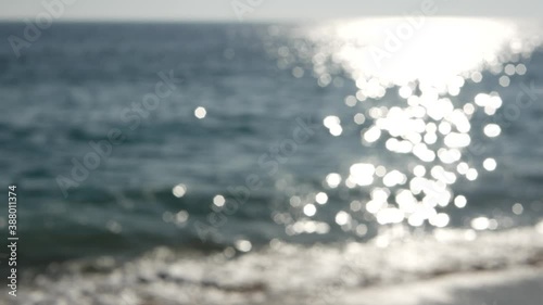 California summertime beach aesthetic, blurred defocused water wave. Shiny sun track and sunlight. Santa Monica pacific ocean resort. Dreamlike tranquil nebulous background. Unclear quiet idyllic sea.