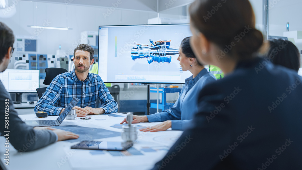 Modern Factory Office Meeting Room: Diverse Team of Engineers, Managers and Investors Talking at Conference Table, Use Interactive TV, Analyze Sustainable Energy Engine Blueprints. High-Tech Facility Modern Factory Office Meeting Room: Diverse Team of Engineers, Managers and Investors Talking at Conference Table, Use Interactive TV, Analyze Sustainable Energy Engine Blueprints. High-Tech Facility
