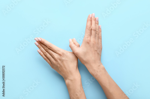 Woman showing dove with her hands on color background. International Day of Peace