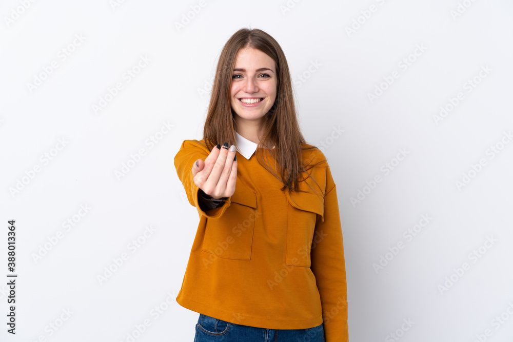 Young woman over isolated white background inviting to come with hand. Happy that you came Young woman over isolated white background inviting to come with hand. Happy that you came