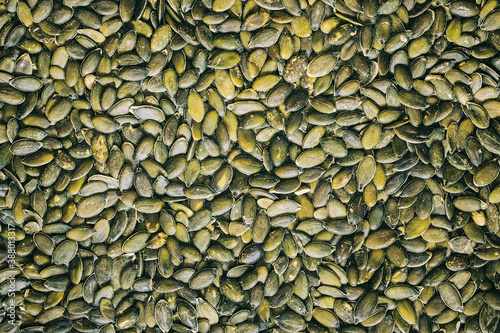Close up on raw hulled pumpkin seeds