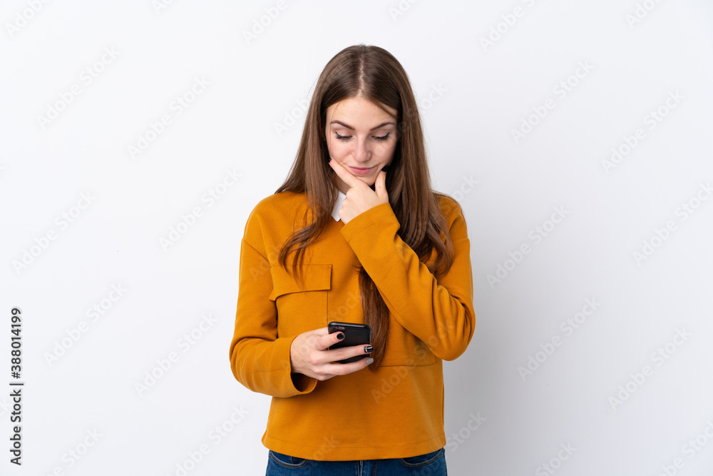 Young woman over isolated white background thinking and sending a message Young woman over isolated white background thinking and sending a message