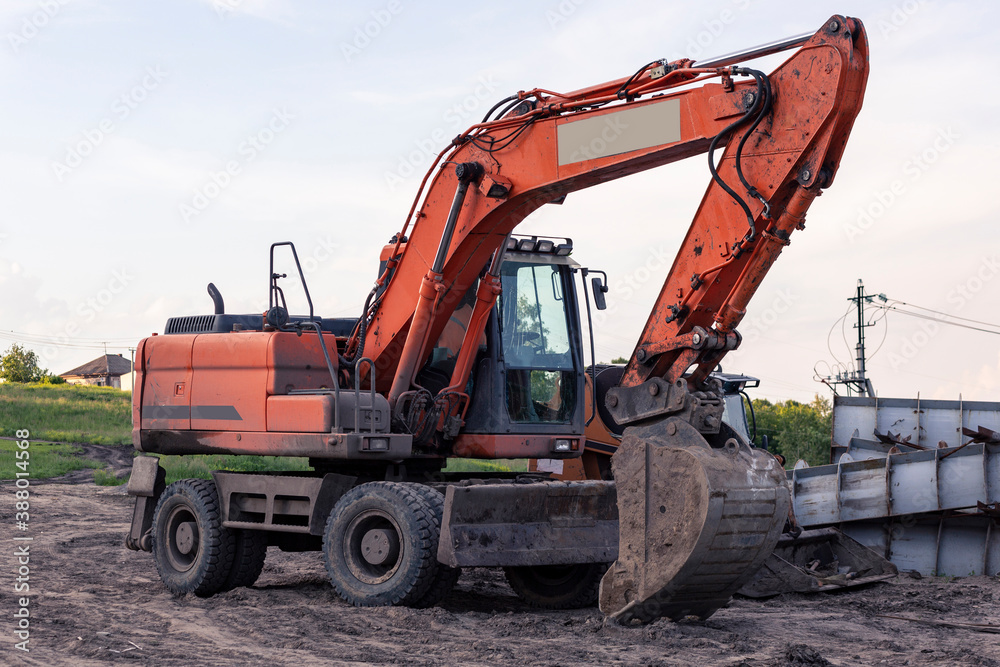 Excavator for excavation at a construction site. Heavy machinery. Excavator for excavation at a construction site. Heavy machinery.