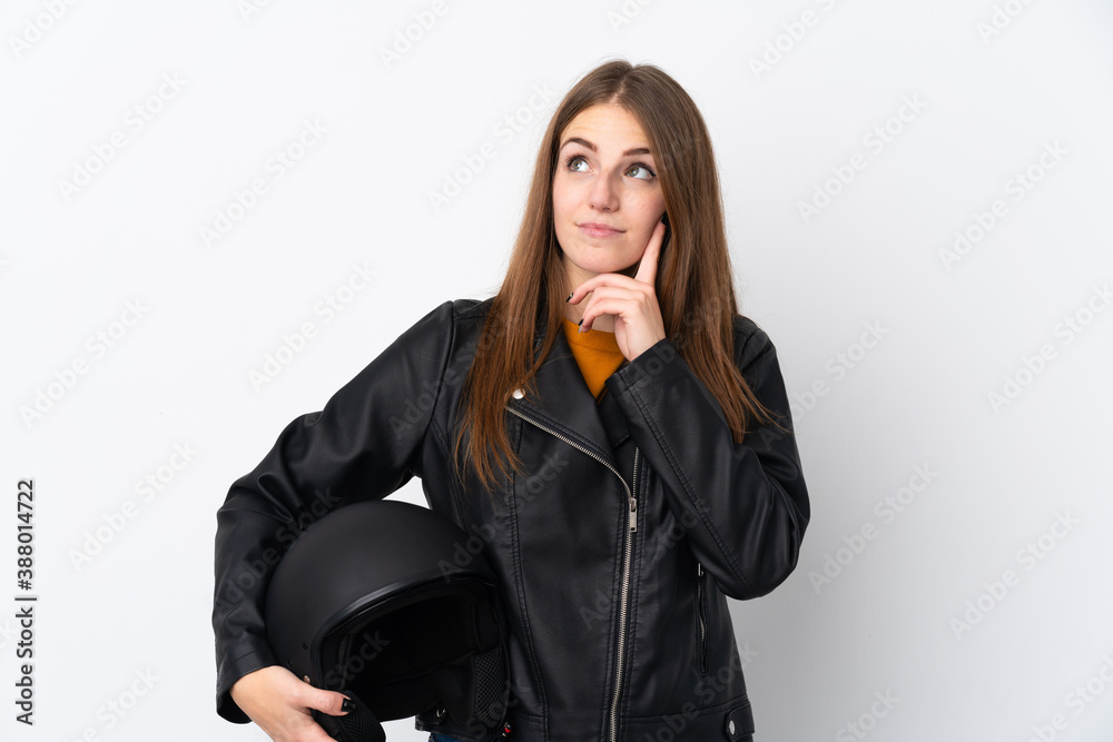 Woman with a motorcycle helmet thinking an idea Woman with a motorcycle helmet thinking an idea